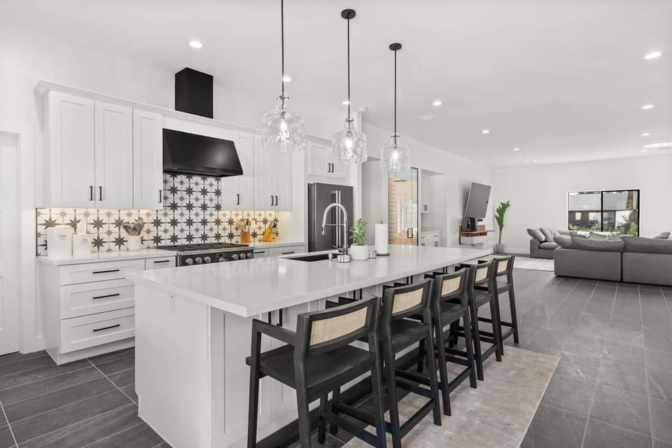 Chef's kitchen, all-white and bright