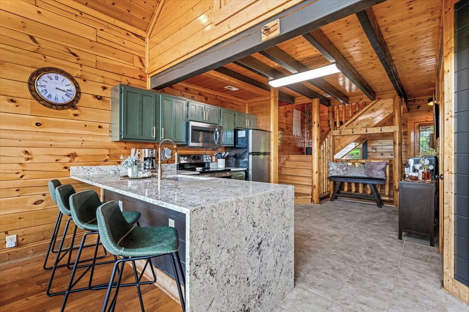 Stylish kitchen with waterfall edge counter!  Making meals/fixing snacks!