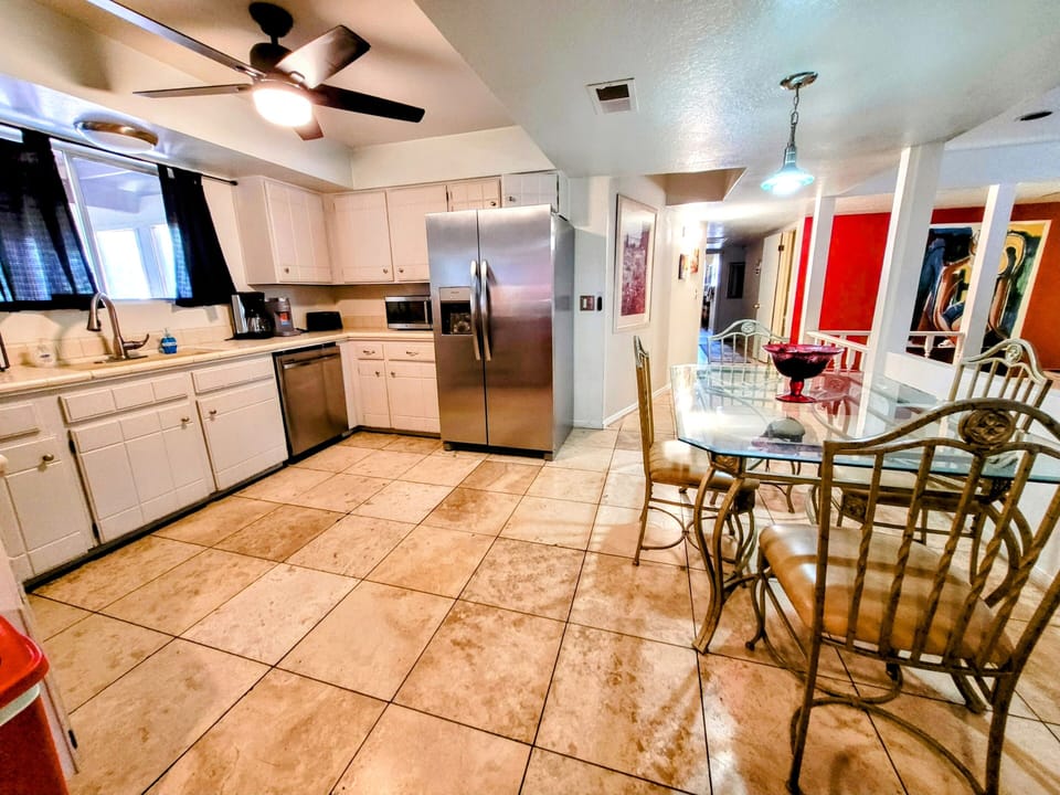 Fully equipped kitchen with pots & pans, dishes,  cups,  mugs, silverware, etc. 