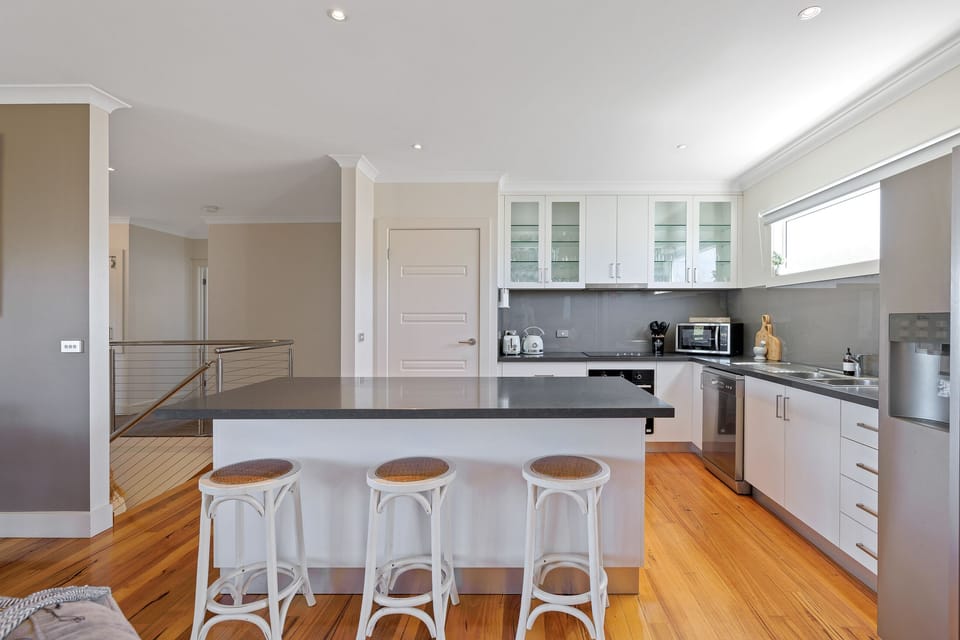Complimented by 40mm stone benchtops with stainless steel appliances