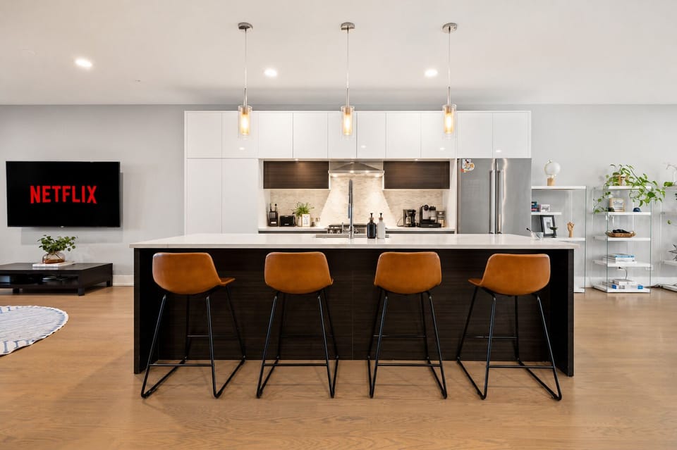 Modern open kitchen with large island seating and sleek designer finishes