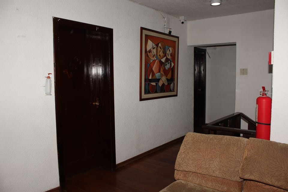 Economy Single Room, 1 Queen Bed | Living area | 32-inch LED TV with satellite channels, TV