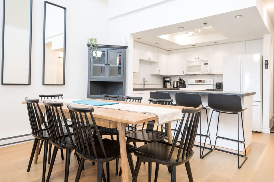 Gather around the cozy dining area that flows effortlessly from the kitchen.