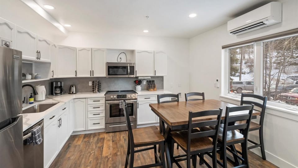 Open concept kitchen and dining area with seating for 6.