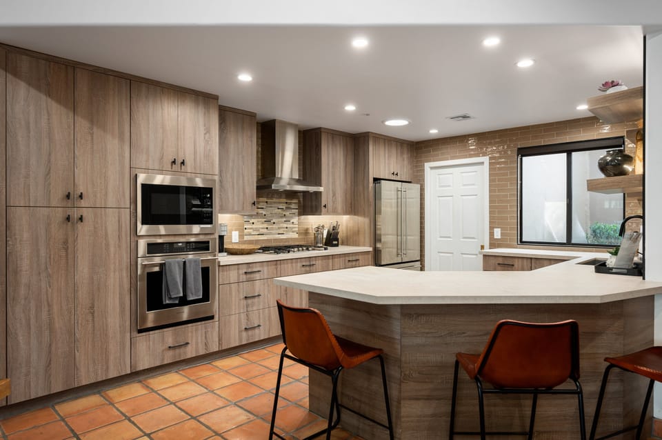 Kitchen space with washer & dryer beyond the door.