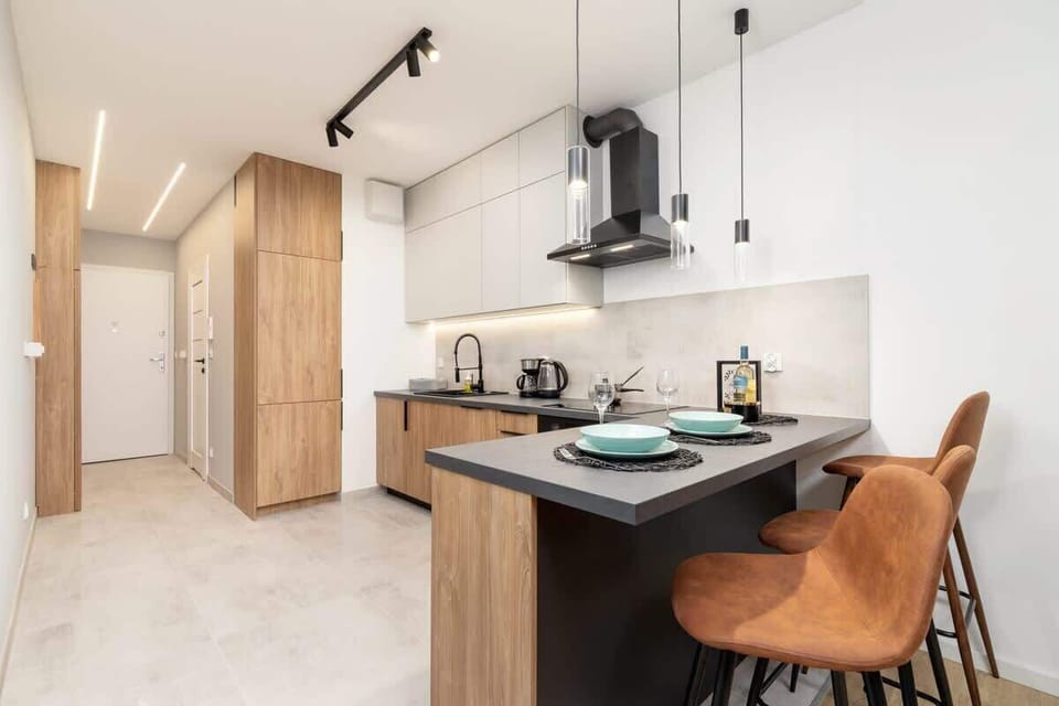 The kitchen area with a dining corner, combining functionality and aesthetics seamlessly.
