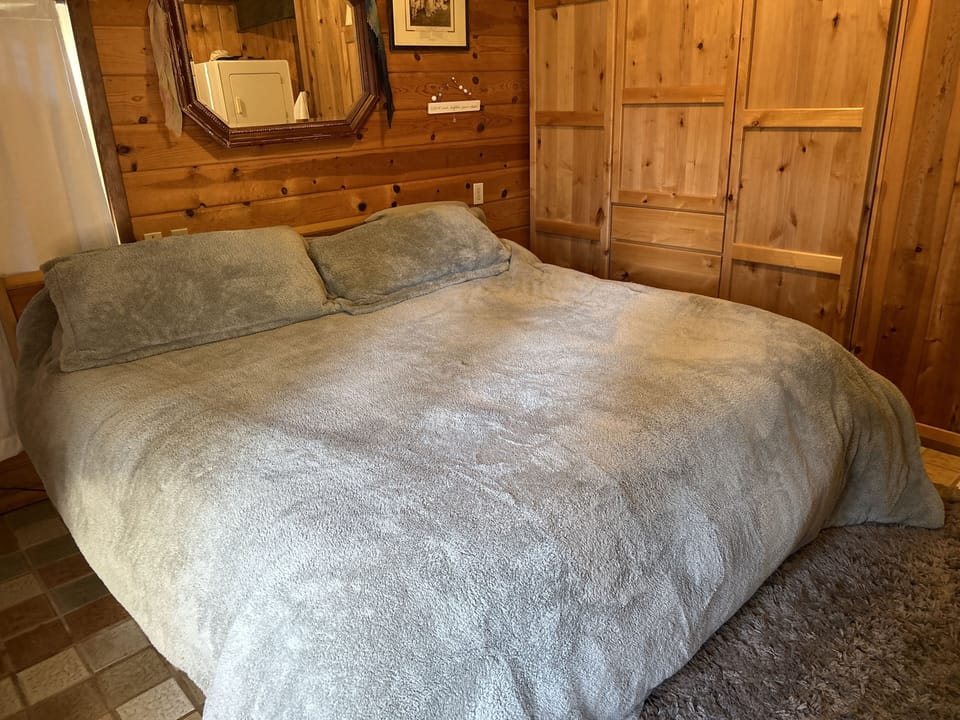 Master bedroom with a full bathroom and washer dryer 