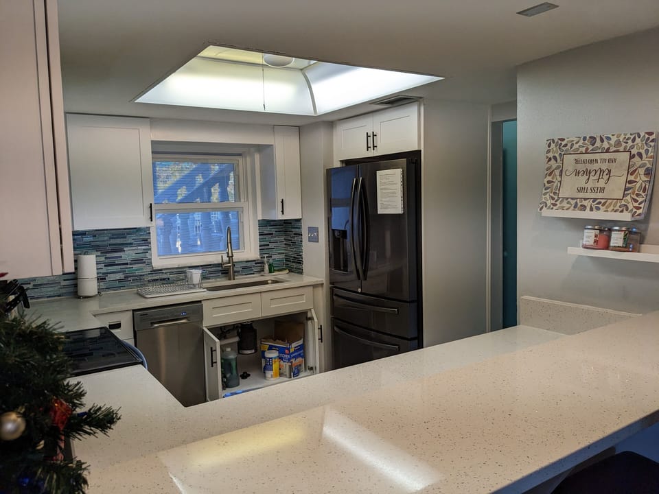 Large Sink with Pull Down Faucet. Refrigerator with Large Ice Maker