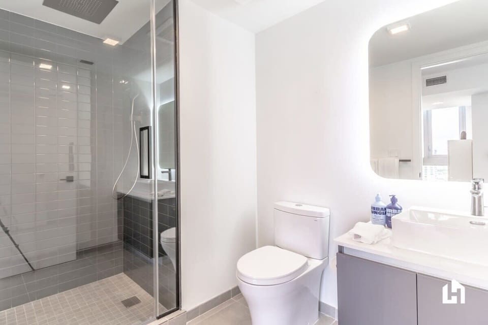 Freshen up in this bathroom, complete with a walk-in shower and a modern vanity.