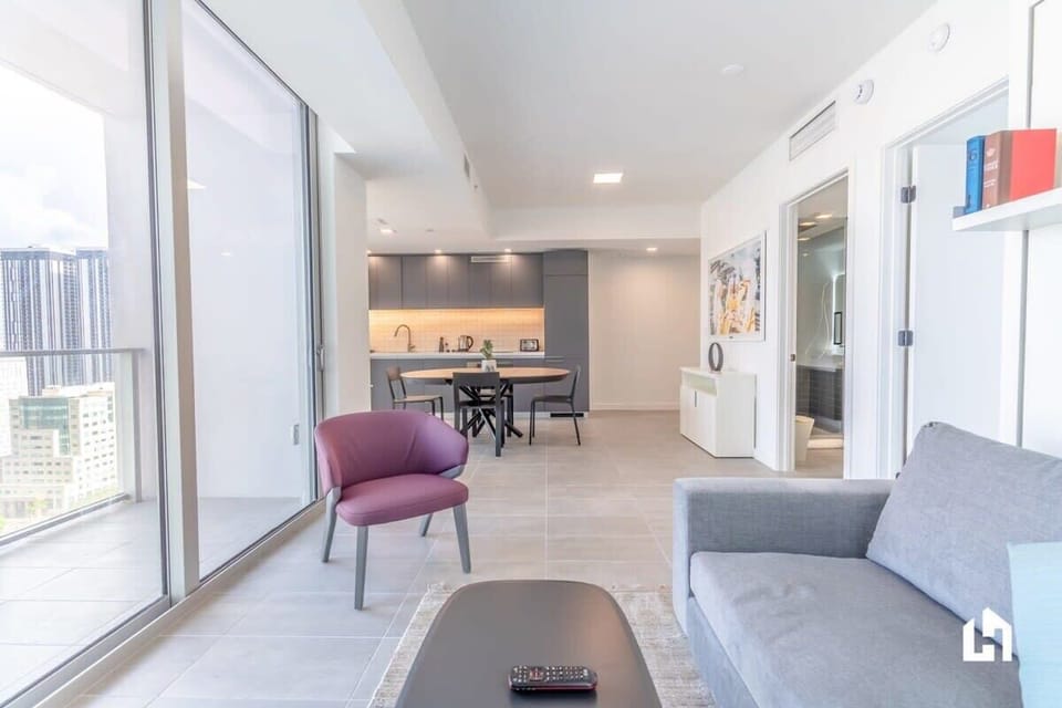 Relax in this bright living room with comfortable seating.