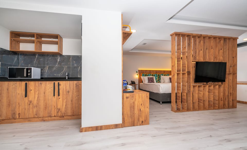 Family Studio Suite, 1 Bedroom, Smoking | Minibar, in-room safe, iron/ironing board, free WiFi
