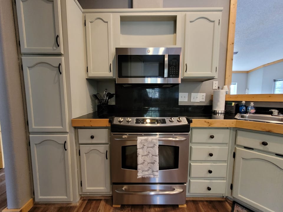 The Kitchen features modern stainless steel appliances