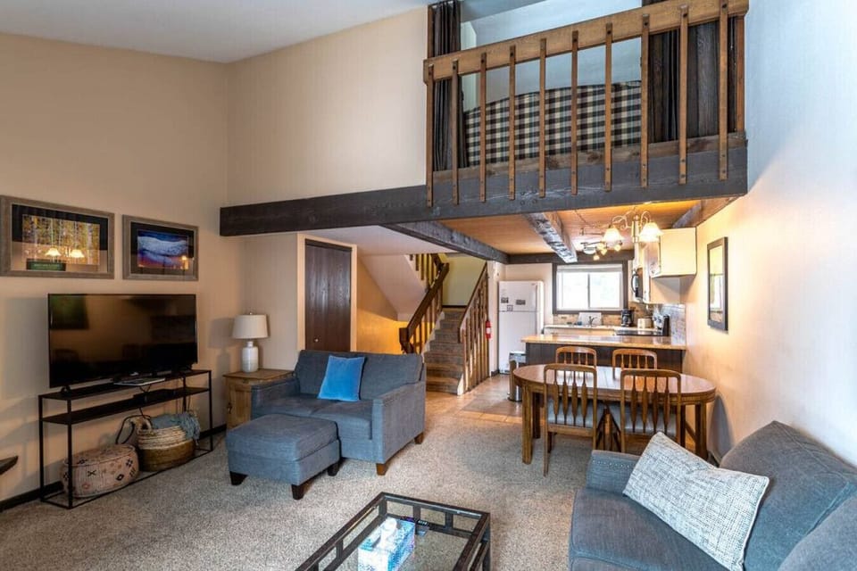 balcony overlooking living room with privacy curtain