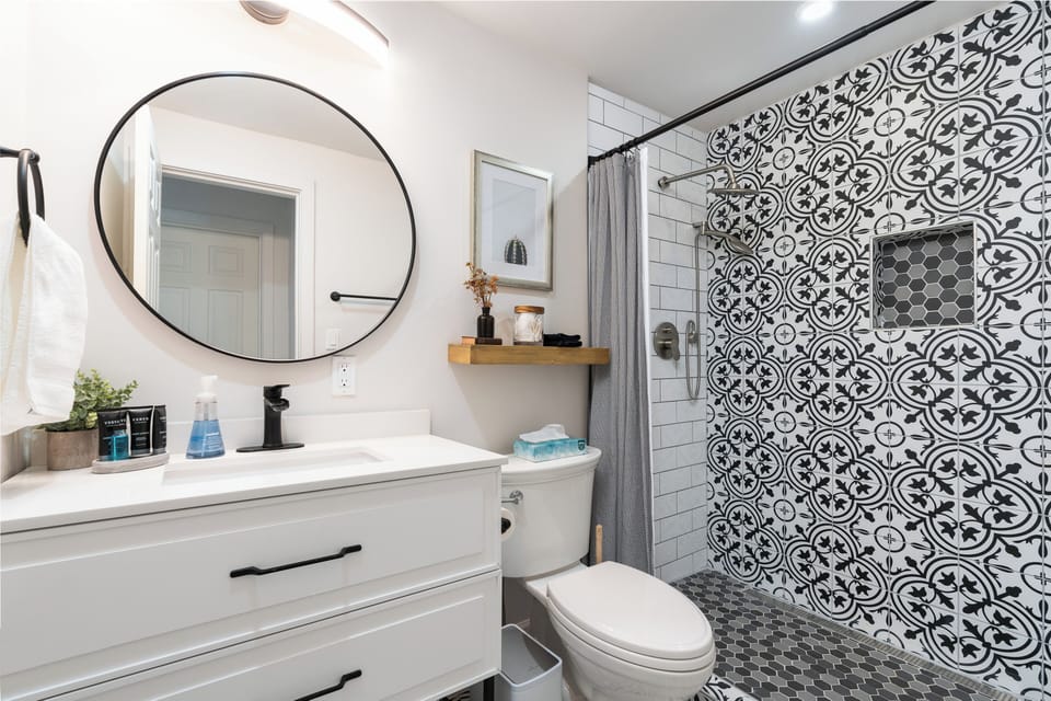 Bathroom 2 features a walk-in shower and the cutest cactus photo I've ever seen.