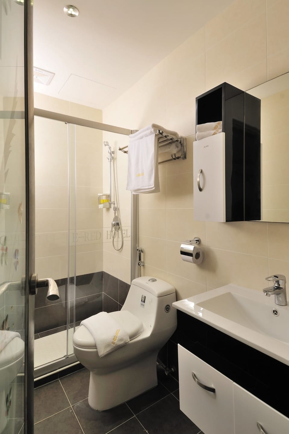 Shower, hair dryer, slippers, towels