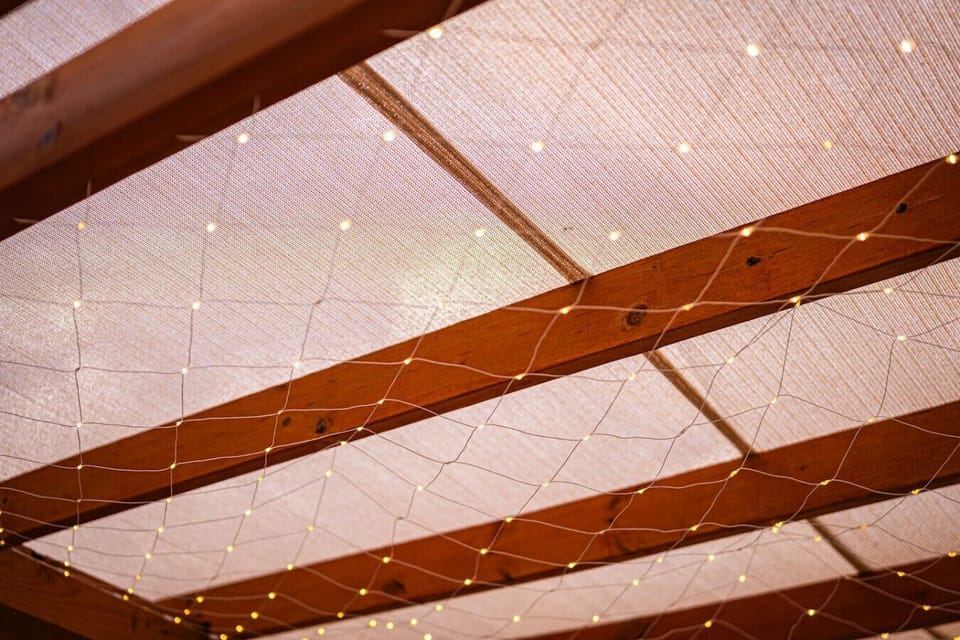 Twinkling lights on the covered pergola