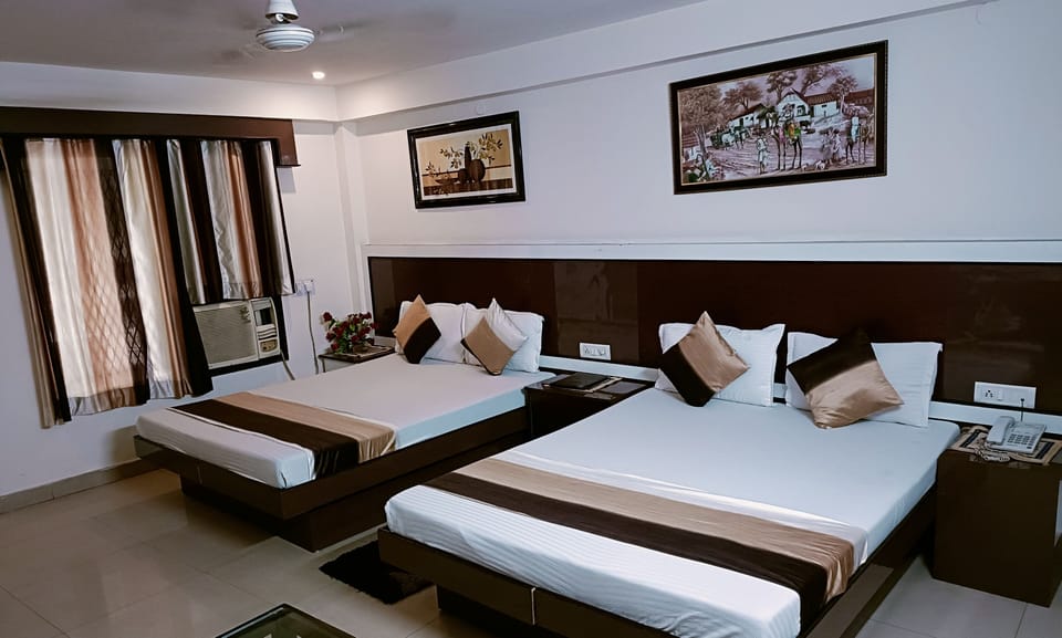 Family Room ( A/C ) | In-room safe, desk, free WiFi, bed sheets