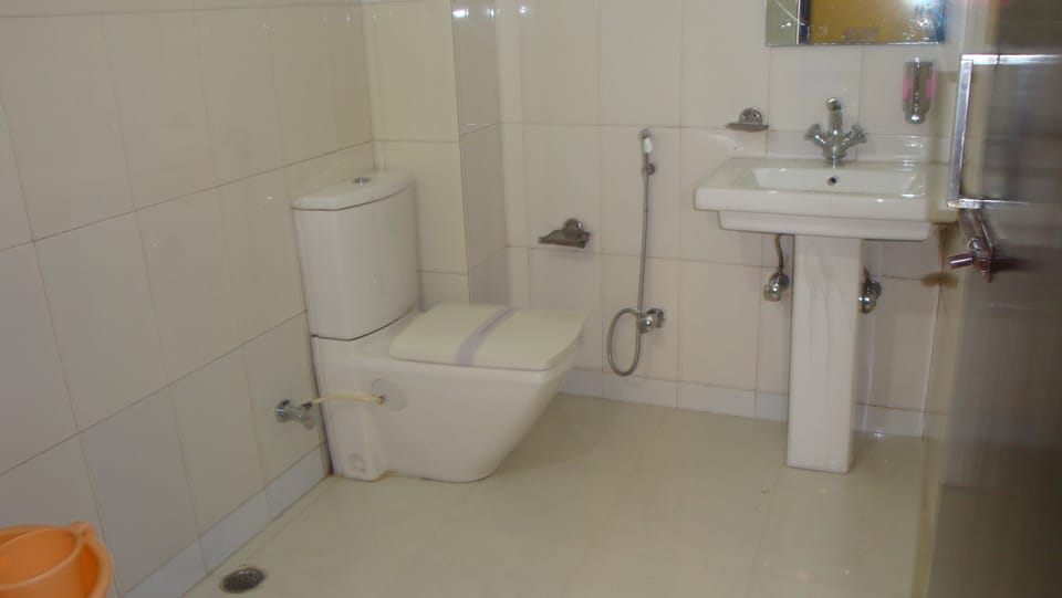 Deluxe Double Room ( A/C ) | Bathroom | Shower, free toiletries, hair dryer, slippers