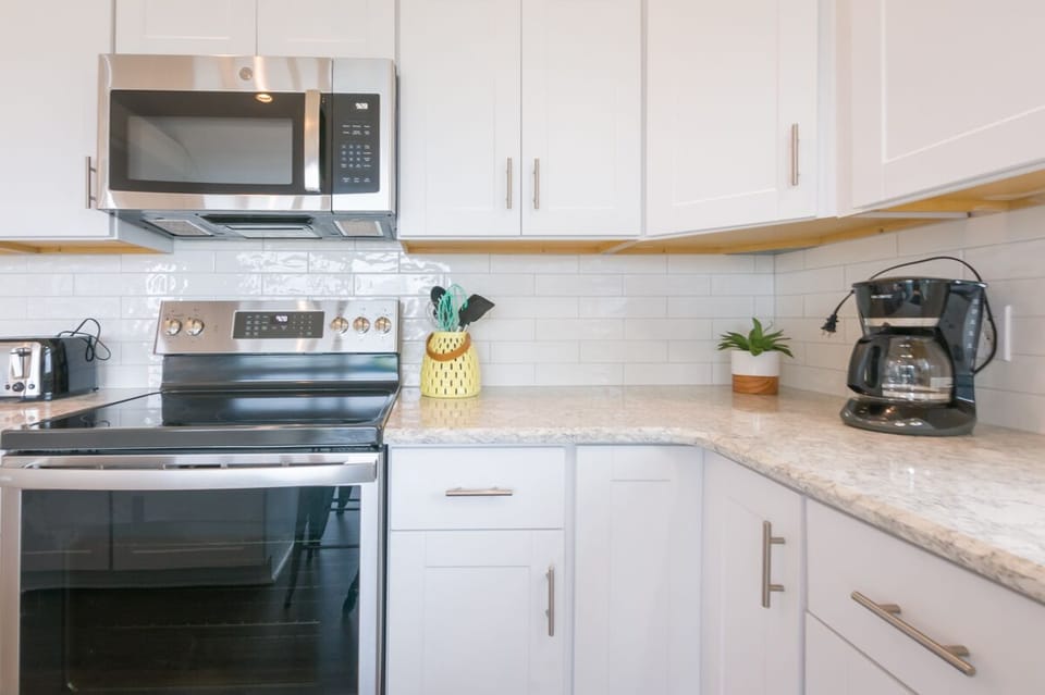 Updated white cabinets, stainless steal appliances and granite countertops.