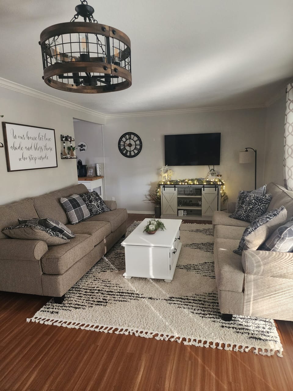 Living Room with 2 new couches, coffee table, and smart TV. 