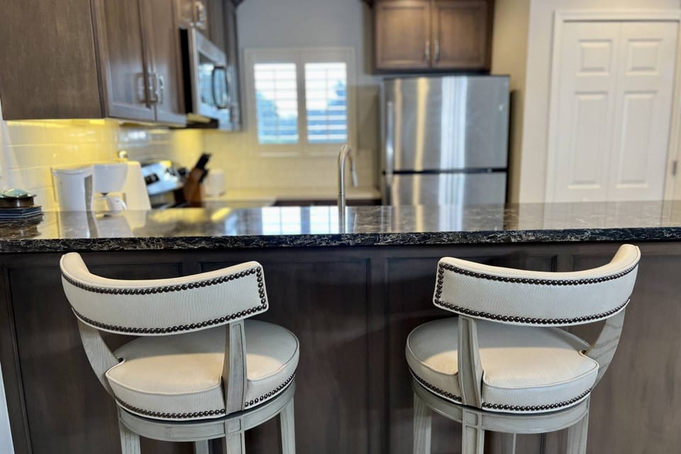 Have a seat at the island on one of the two bar stools!