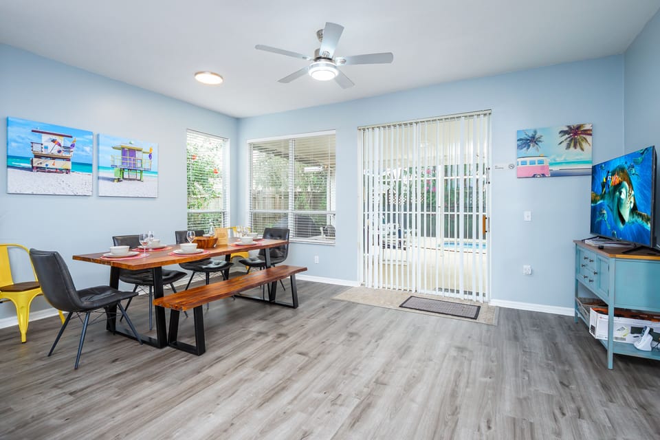 Dining Area with TV and views out to the pool area