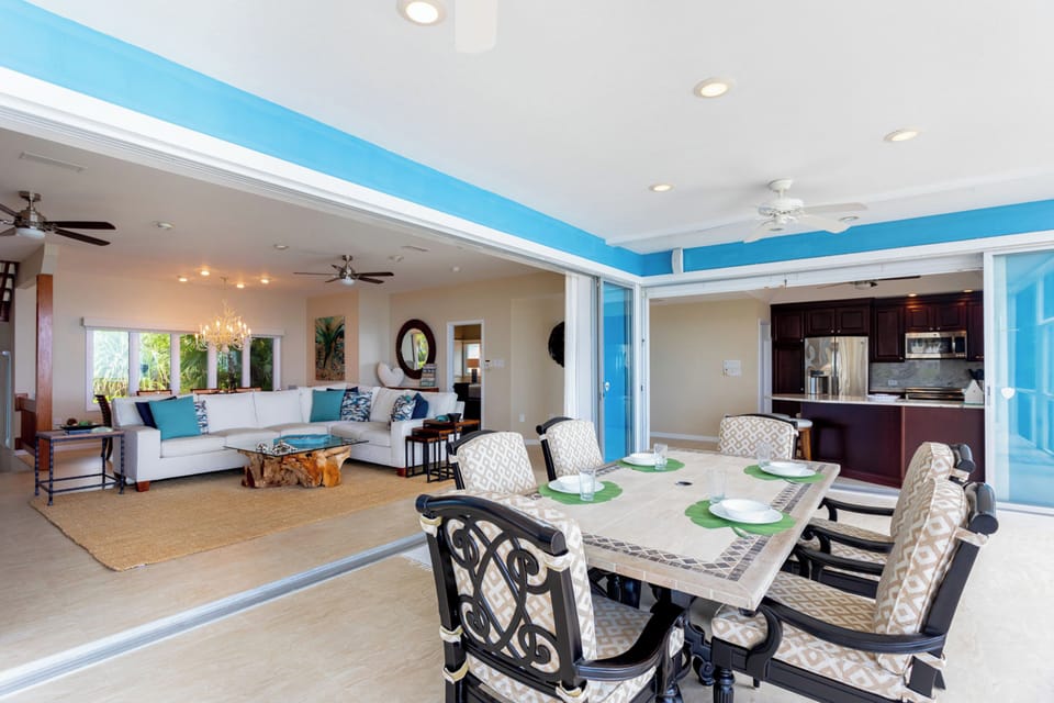 Great room and kitchen both open out to the screened porch. 