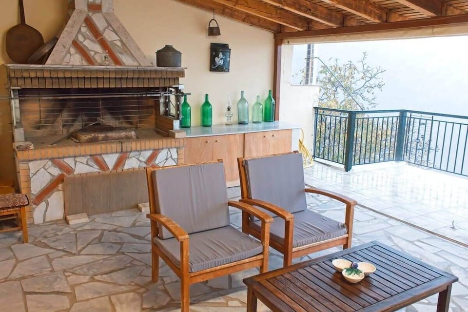 Outdoor Dining Table Under the Roofed Patio – Ideal setting for breakfast or dinner in the open air.