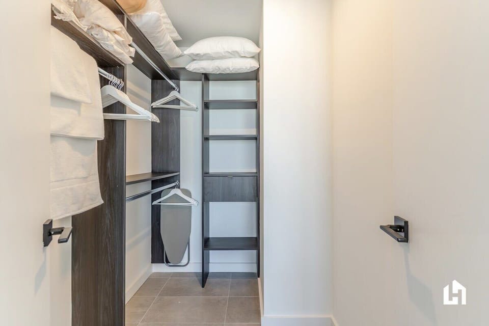 The closet, with iron & ironing board & extra pillows if needed