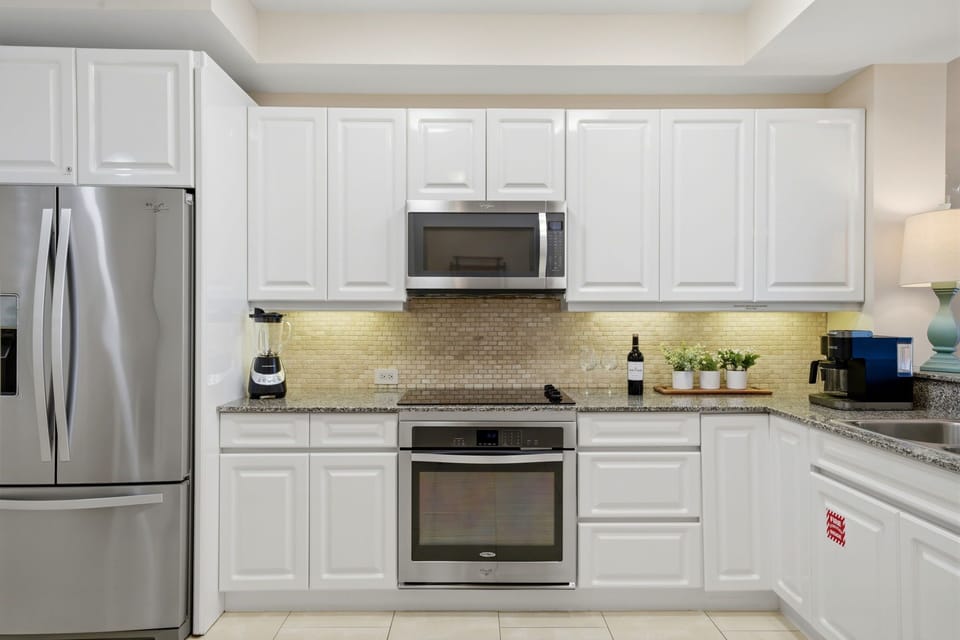 Beach Colony Tower PH1B - Your fully equipped kitchen features stainless steel appliances, ample counter space, and modern fixtures—perfect for preparing meals at your leisure during your stay.