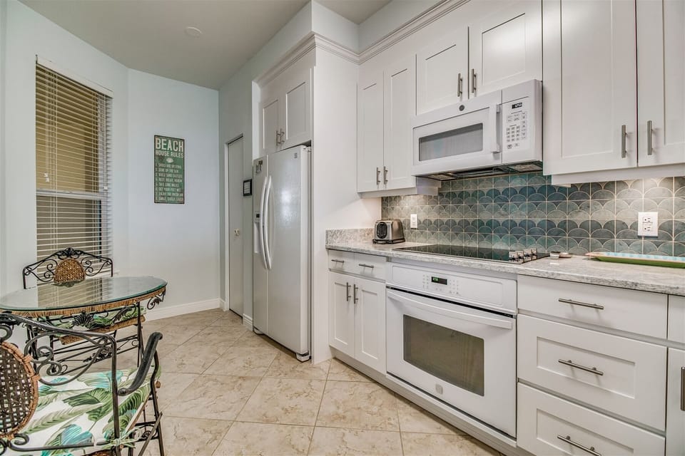Beach Colony West 9B Kitchen Refrigerator, Stove, and Microwave