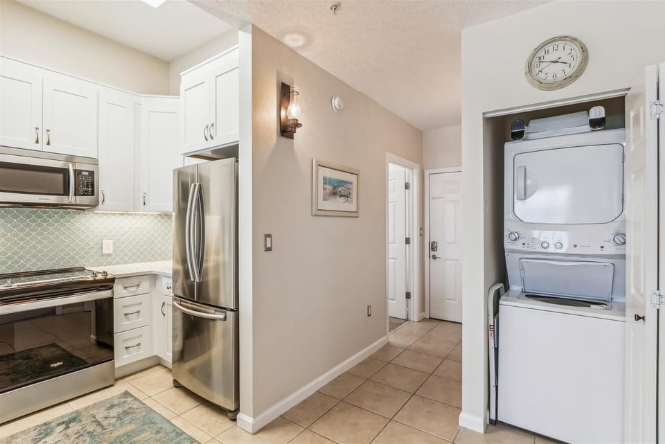 Windemere 407 Kitchen, Front Entrance Hallway, and Laundry in Unit