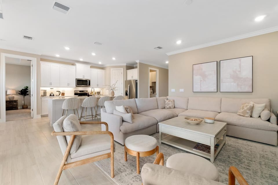 Cozy sectional couch, two additional chairs with ottomans