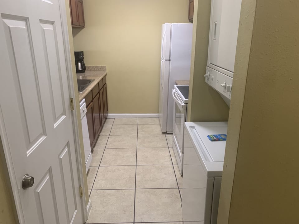 A glimpse of your washer/dryer and kitchen.