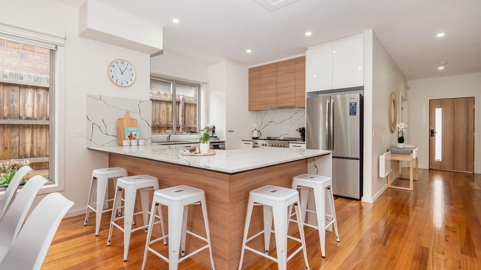 Sleek kitchen area with breakfast bench seating