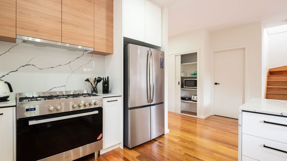 Sleek kitchen with modern, stainless steel appliances