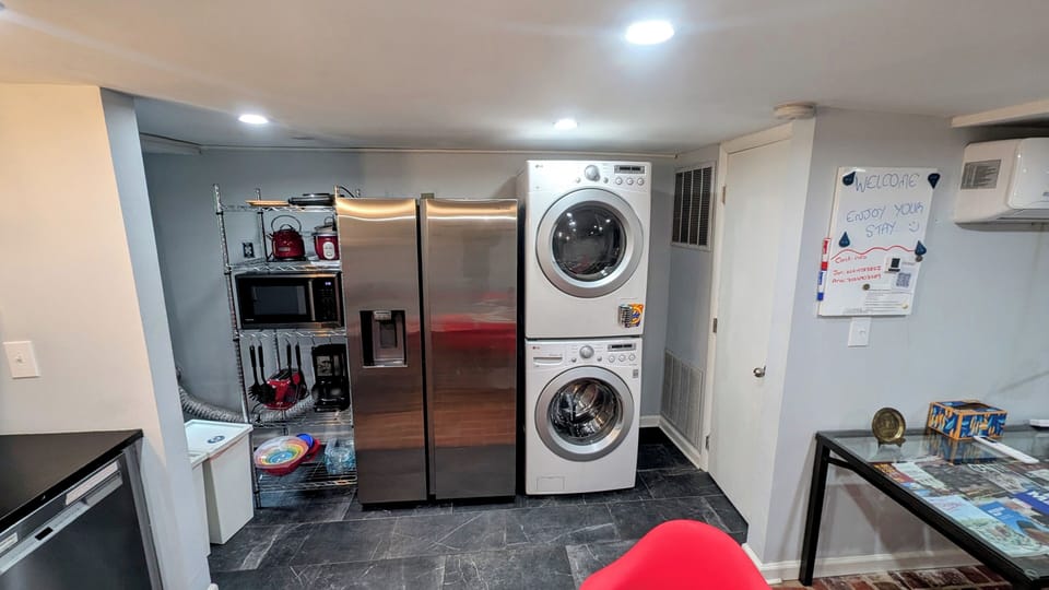 Washer/dryer (with starter wash pods); side by side refrigerator with ice maker.