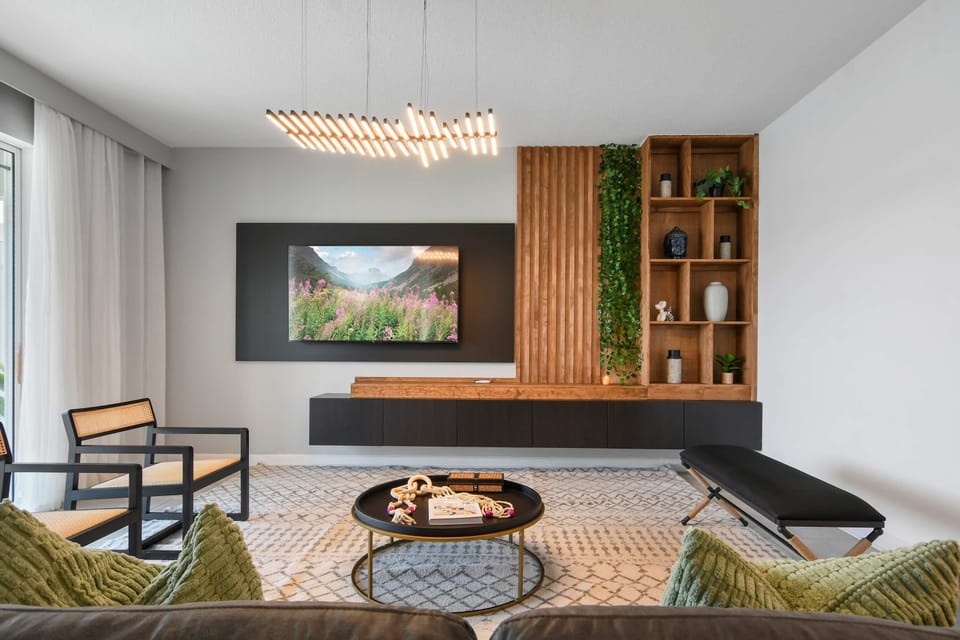 Chic and serene living space with modern accents, greenery, and cozy vibes.