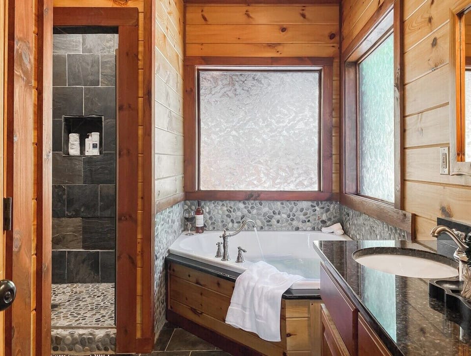 …with a slate shower AND a luxurious soaking tub!