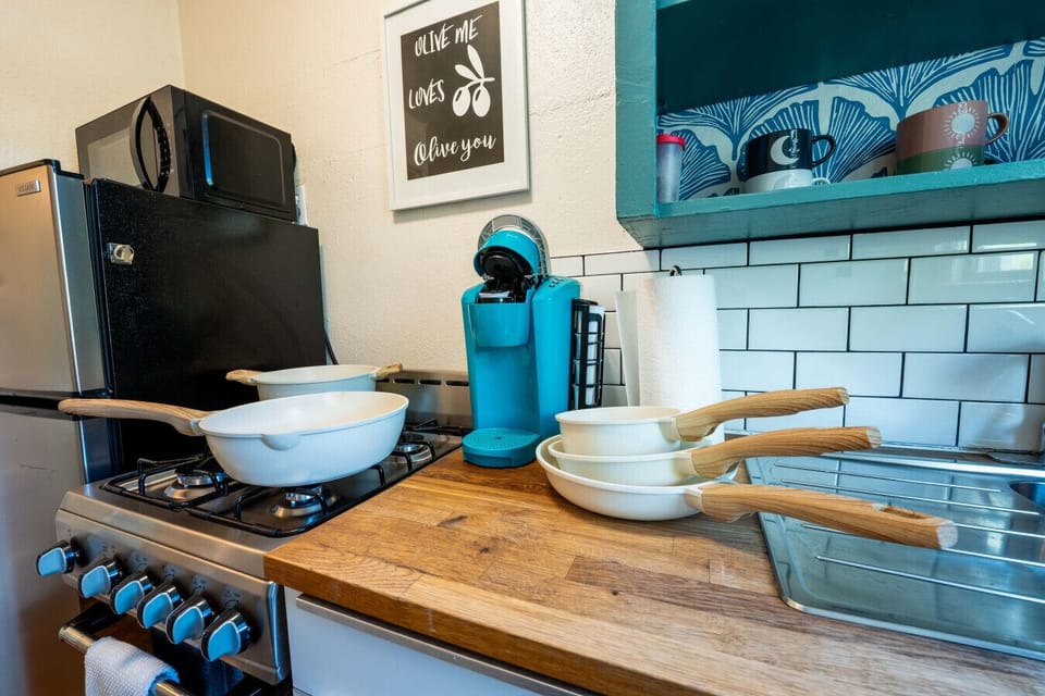 Charming Kitchen: Cook up a feast with modern appliances and unique decor in vibrant Tucson!