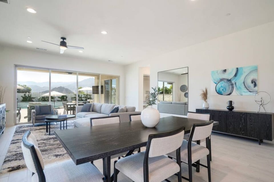 Open dining area w/ patio views & seamless flow into the sunlit living space