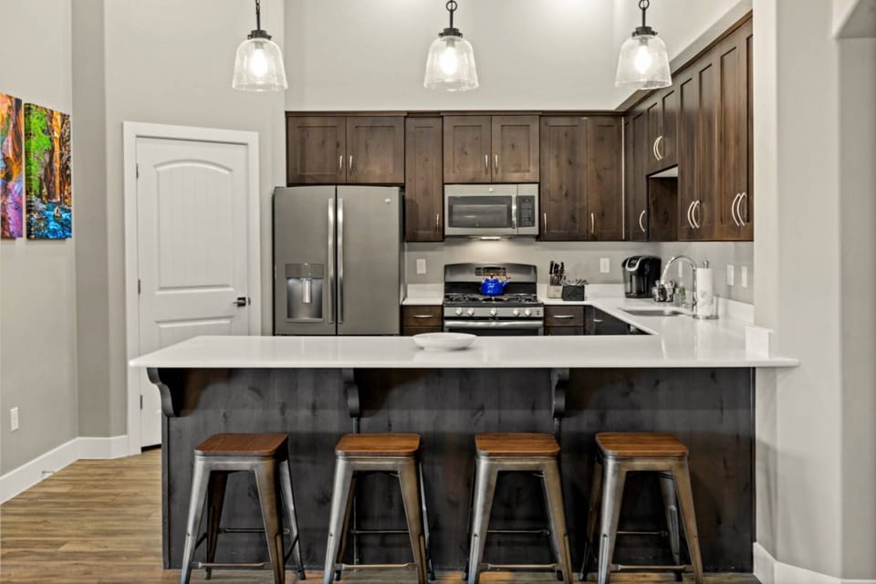 Bar with 4 Barstools provides that Additional Seating for your Group of 12