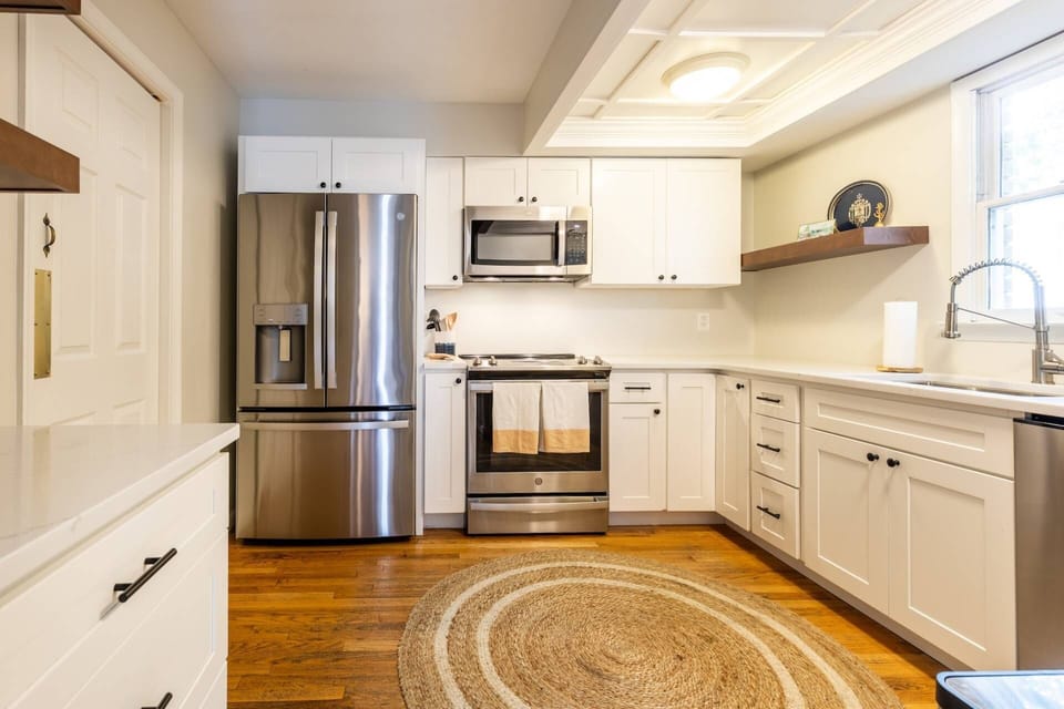 The gourmet kitchen has been recently renovated to include stainless-steel appliances.