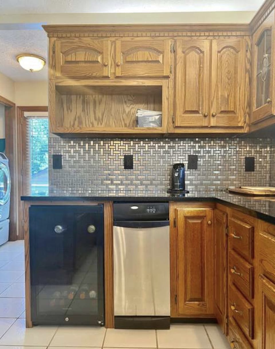 Modern kitchen. Trash compactor and wine fridge 