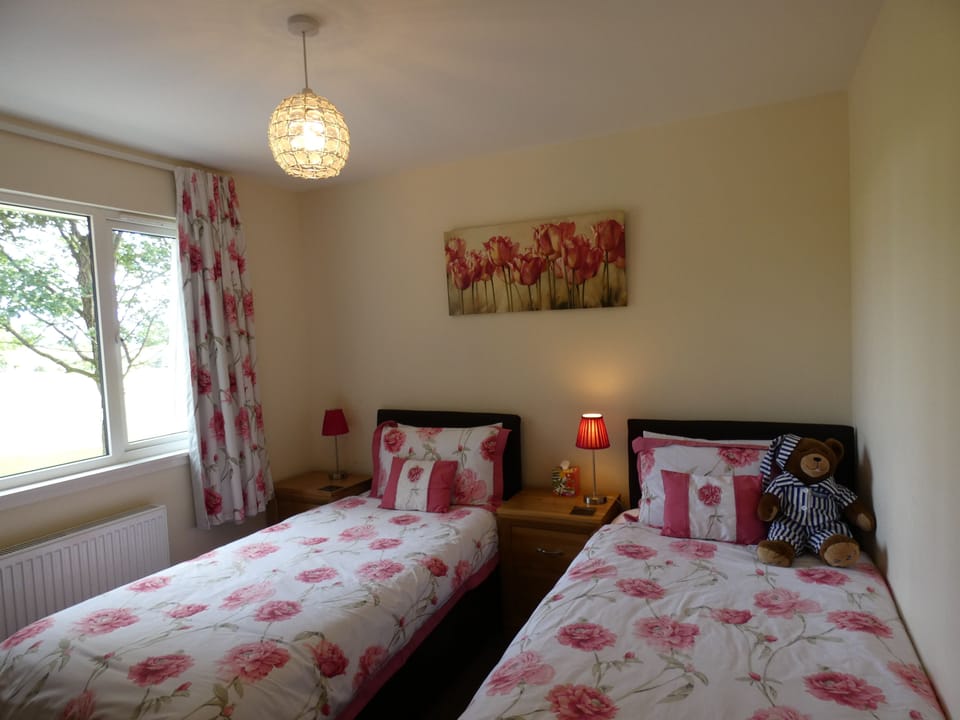 Twin bedroom with built in wardrobes.