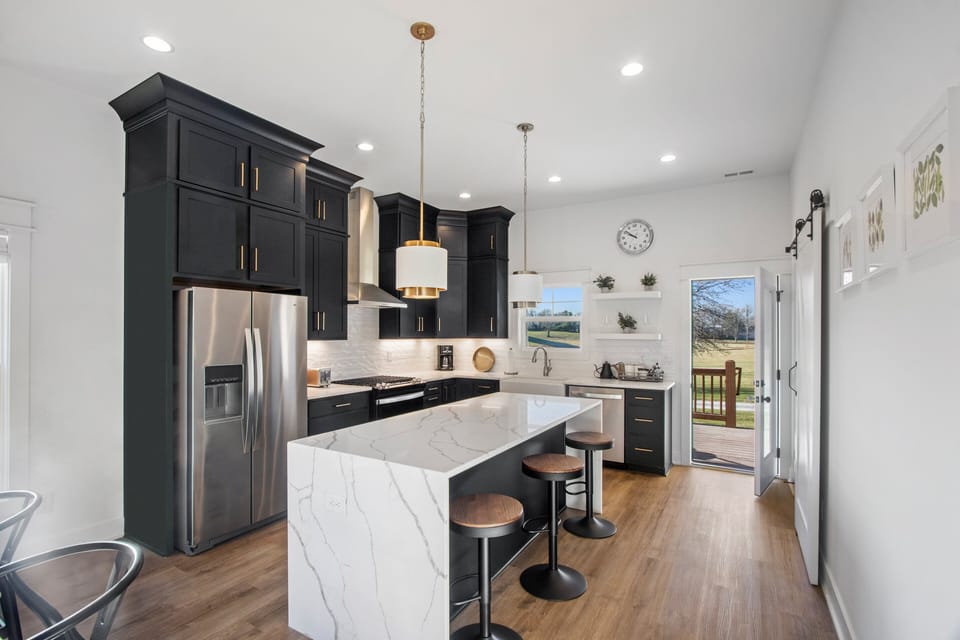 Marble peninsula features extra counter stools