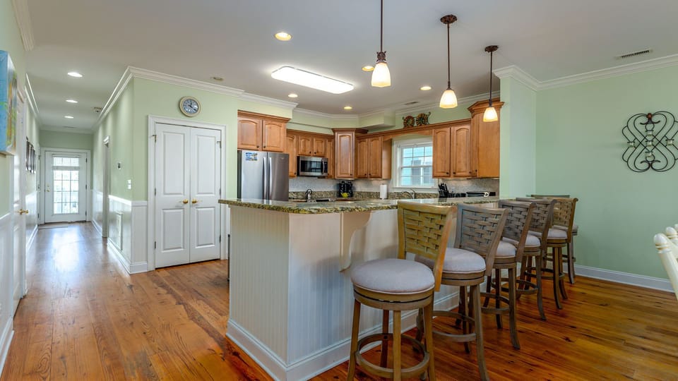 Your open kitchen features granite countertops, stainless steel appliances, and a breakfast bar where you can start each morning with coffee.