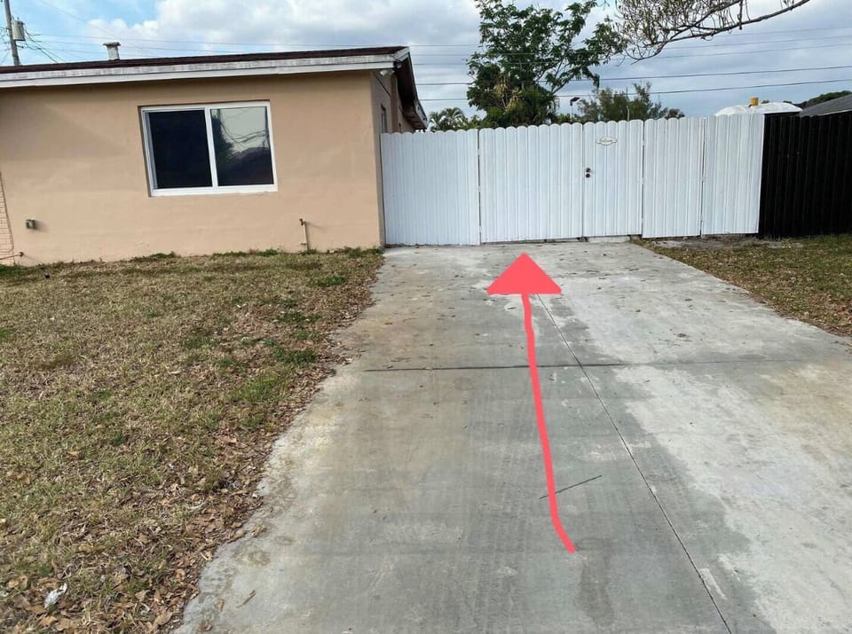 Open this gate facing the house to your right