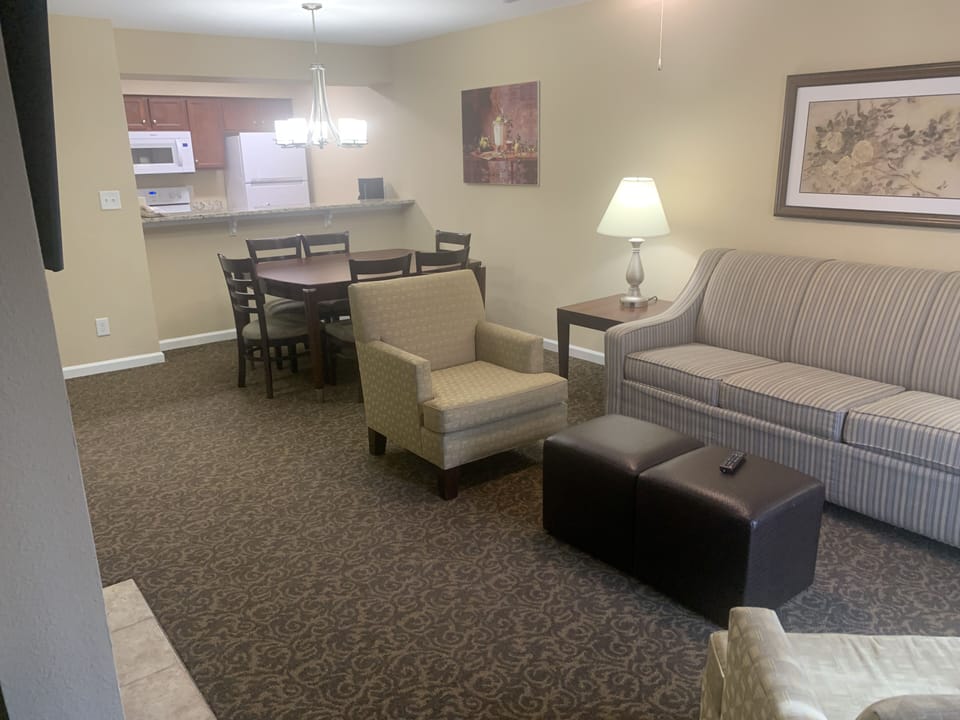 Your living room has a pull-out couch, TV, electric fireplace & plenty of seats