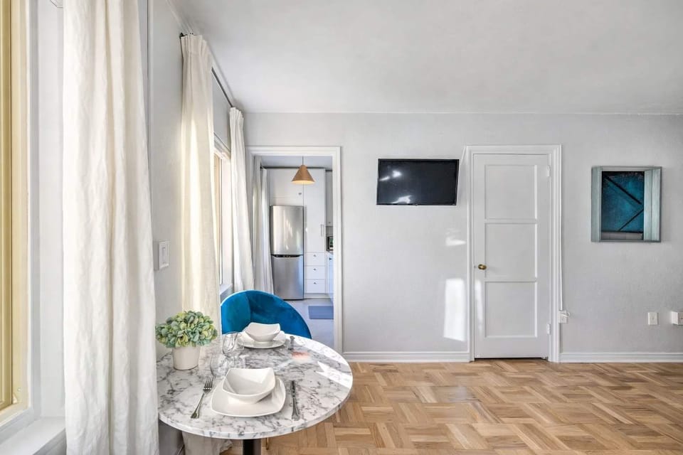Cozy dining nook with natural light, perfect for enjoying coffee, meals, or planning your day.